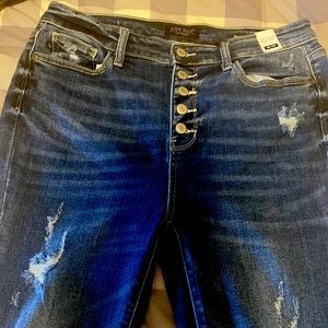 Judy Blue mid rise trouser flare cut. Button ups with slight distressing.